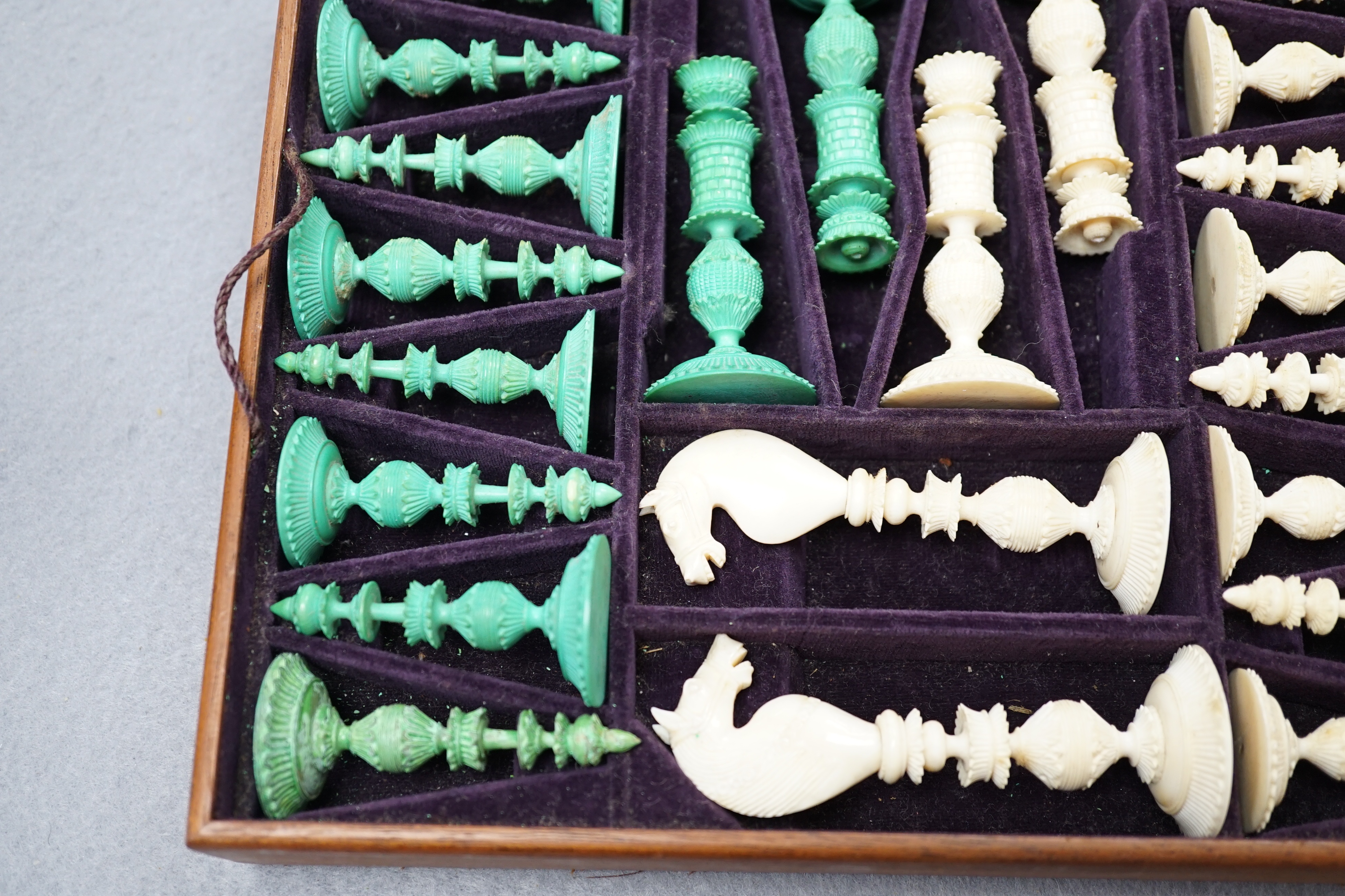 A boxed 19th century Burmese pattern ivory chess set, one pawn restored, king height 11cm